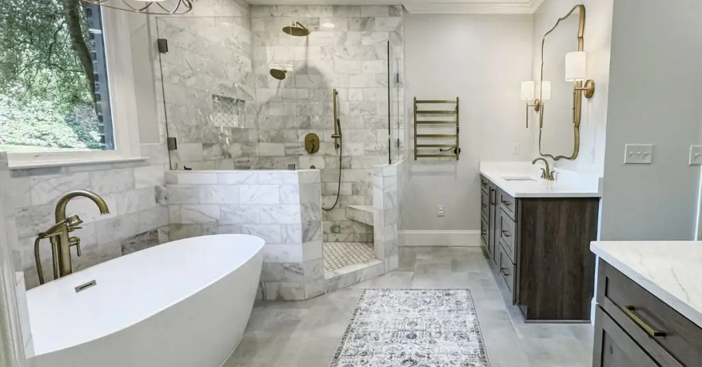 a bedroom with a large tub next to a sink