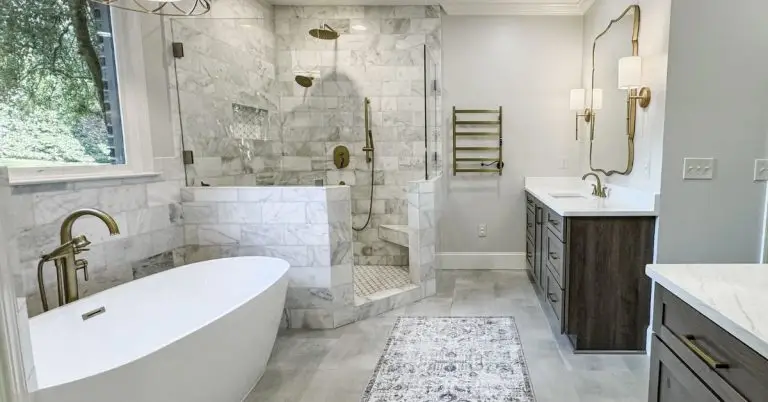 a bedroom with a large tub next to a sink