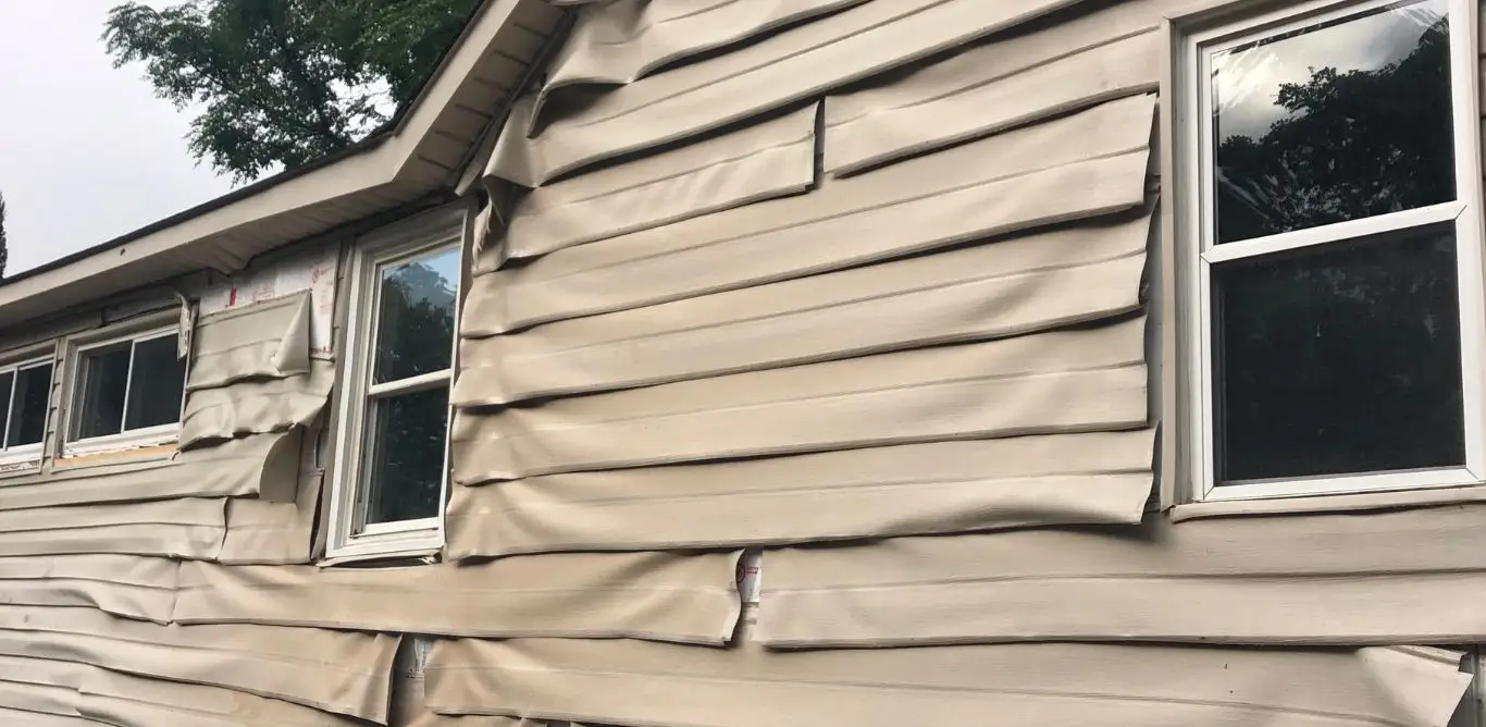 A house in Birmingham AL with melted vinyl siding