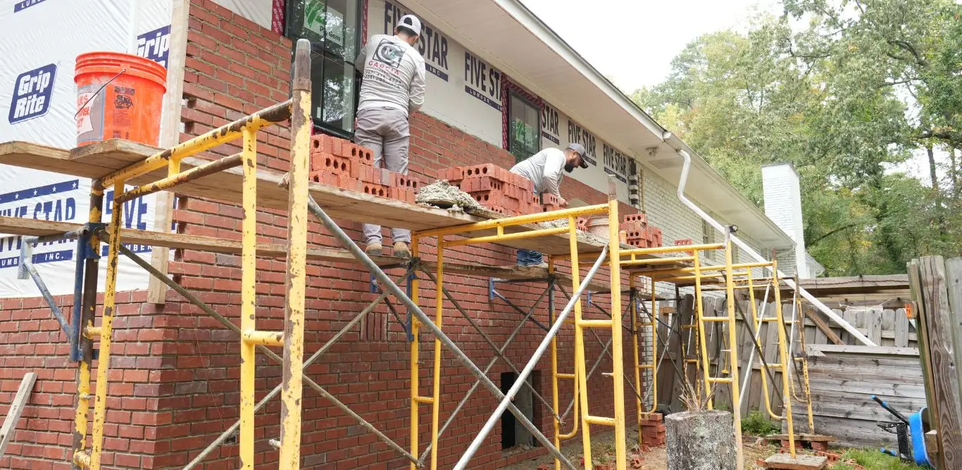 A room addition in Hoover AL with brick being installed.
