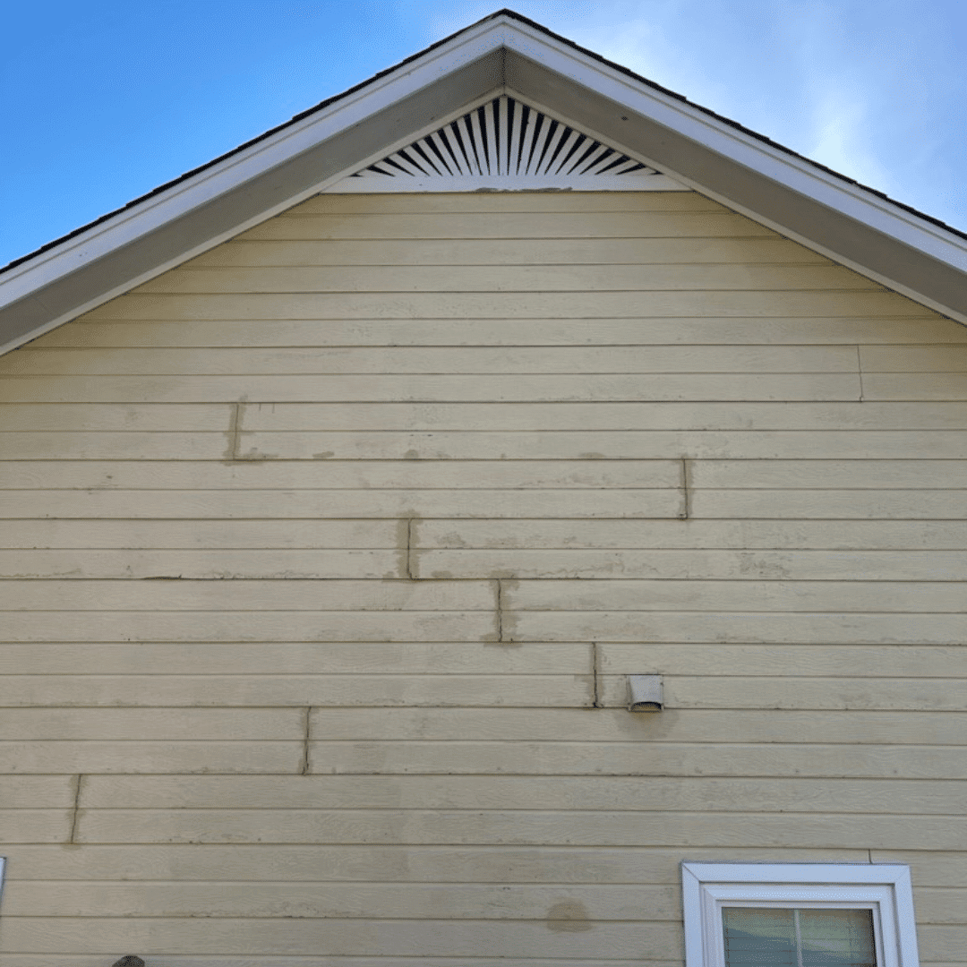 Seeing cracked caulk in masonite siding tells you it's time for a paint job