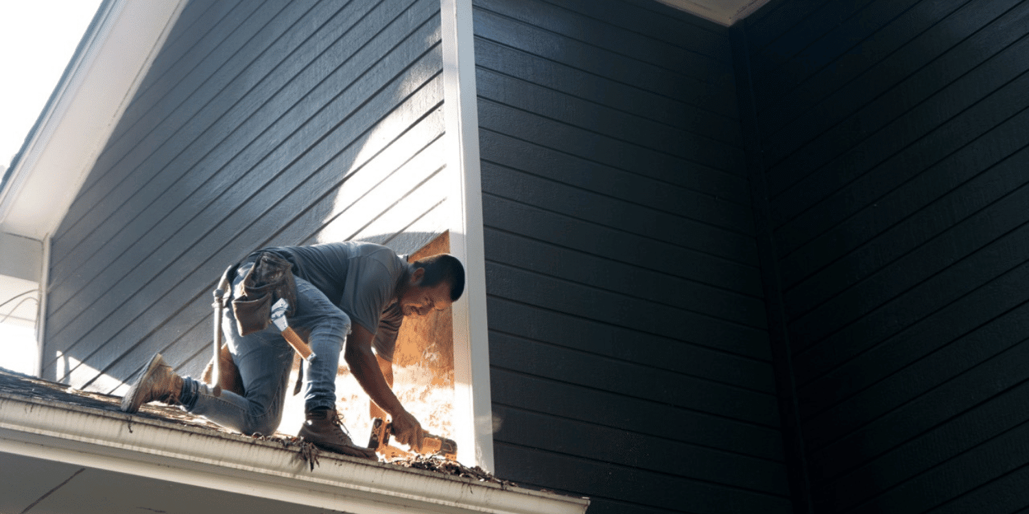 A section of Masonite siding being replaced