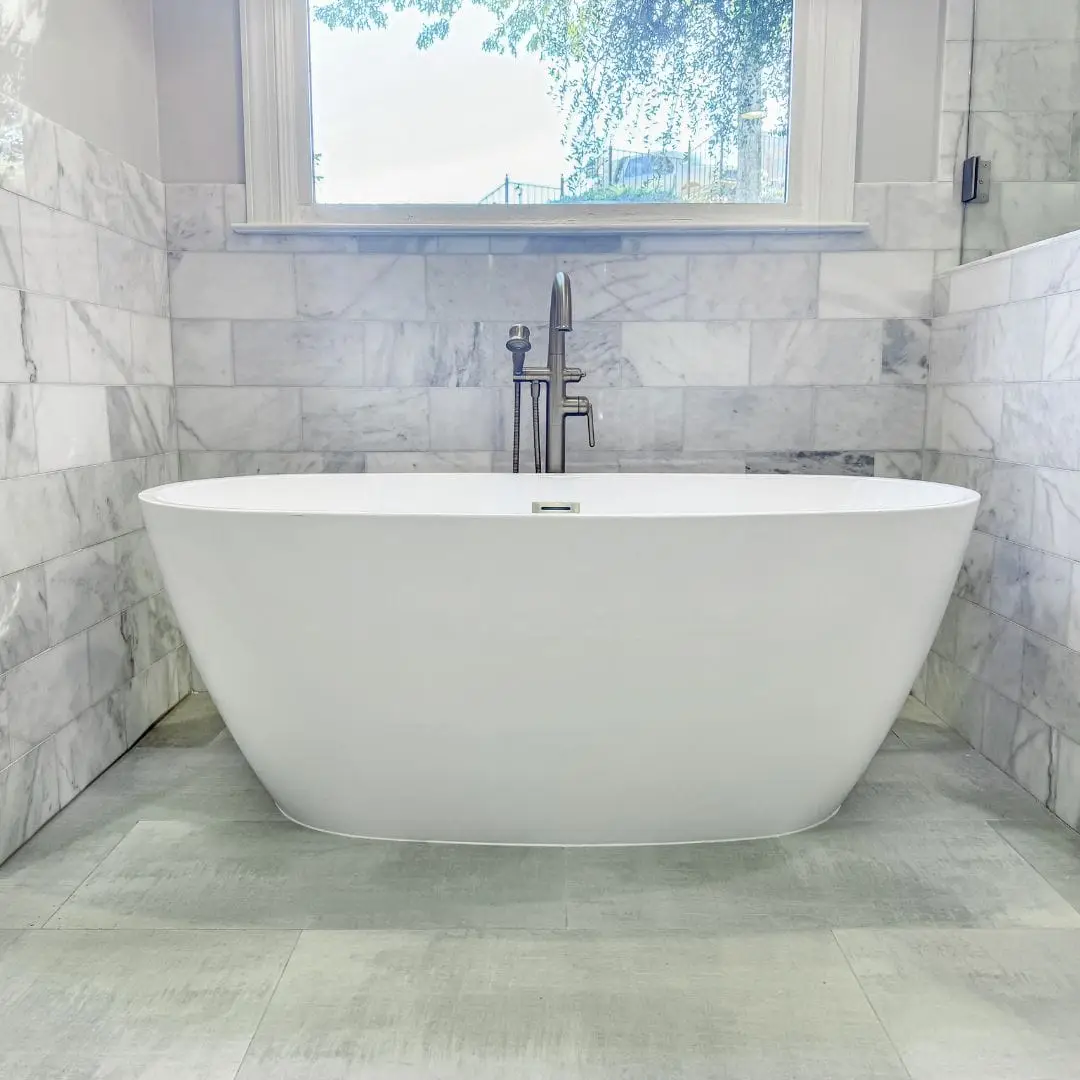 a large tub next to a window