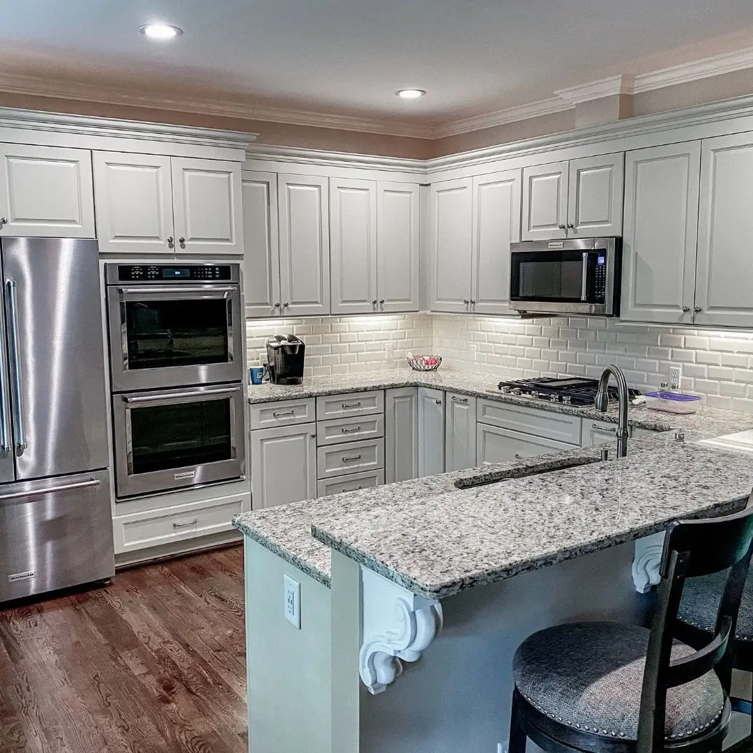 a modern kitchen with stainless steel appliances