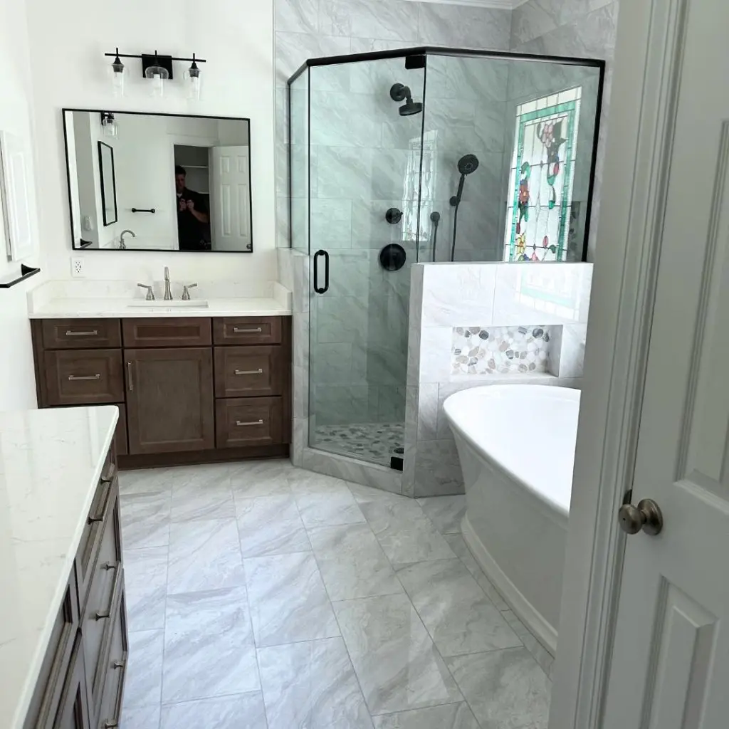a bedroom with a bed and a mirror