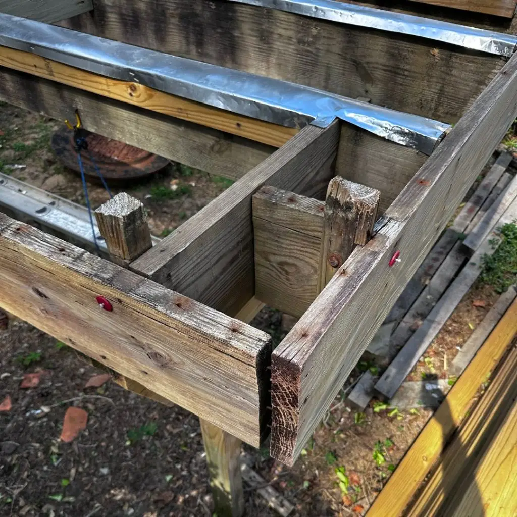 A deck in Mountain Brook, AL, with a rotted frame, in need of deck repairs.