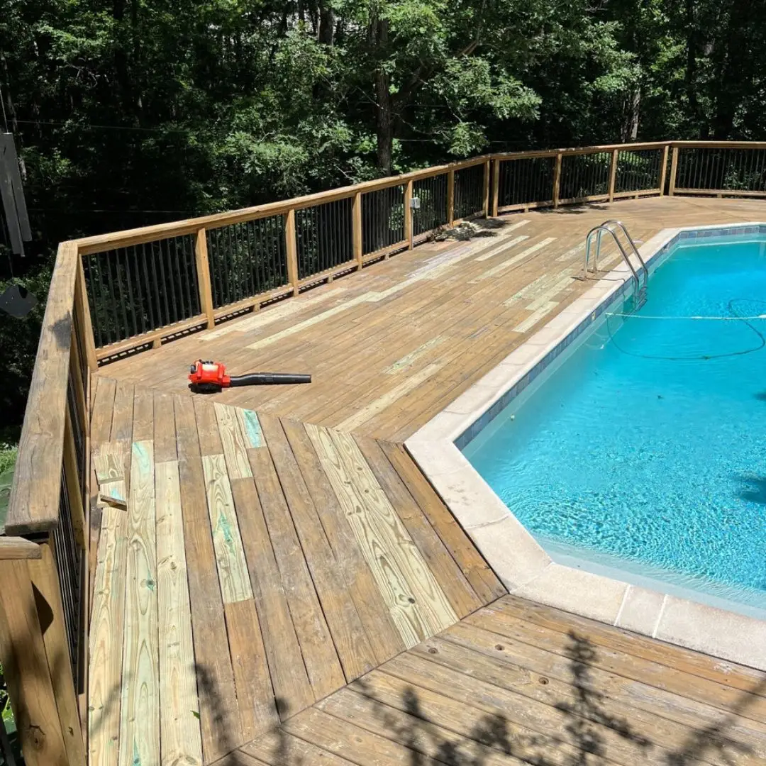 A deck in Pelham, AL with several deck boards replaced by our deck repair contractors.