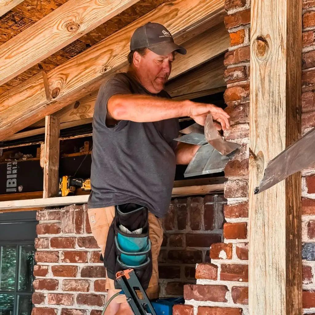 a man repairing a chimney