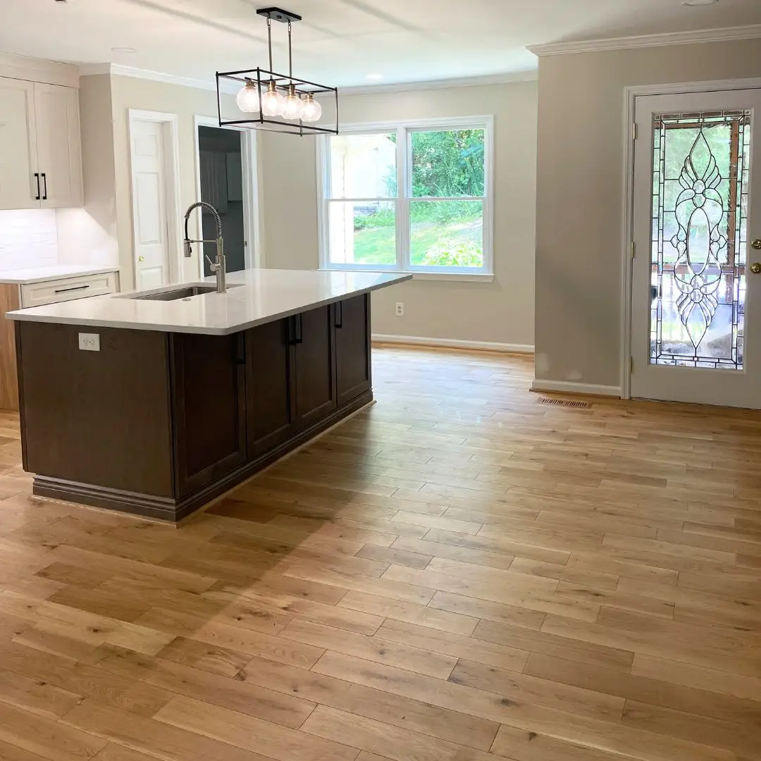 a large empty room with a wood floor