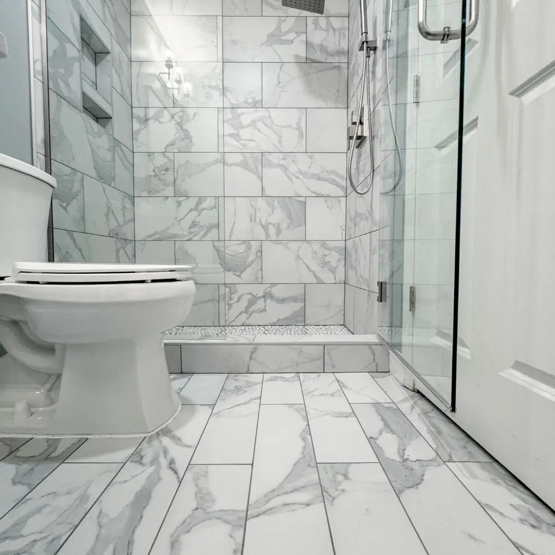 Our recent shower remodeling project with smooth tile and a wail-in shower.