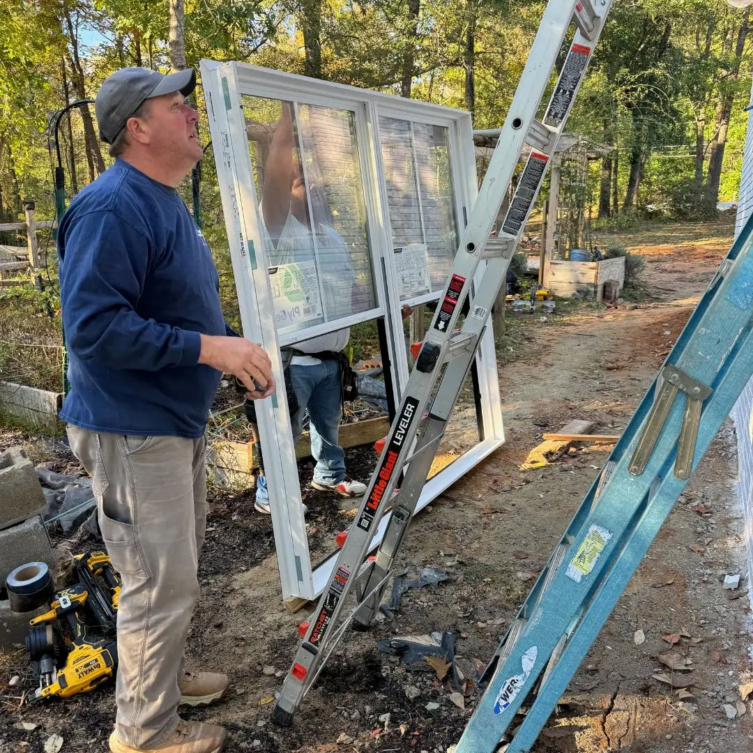 A window installation team getting ready to install a new window in Hoover.
