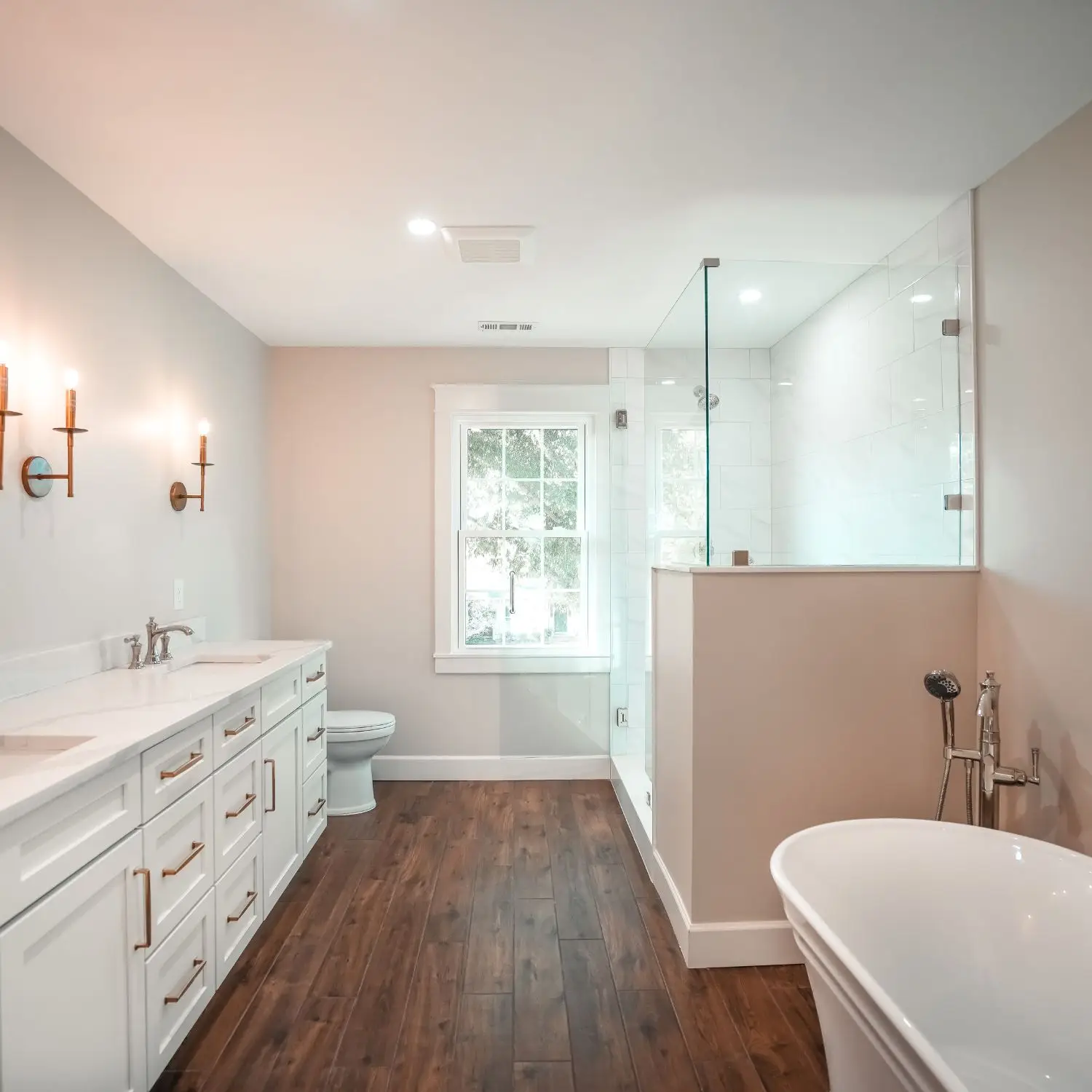 A newly remodeled bathroom in Hoover, AL with a walk-in shower, soaking tub, and large double vanity