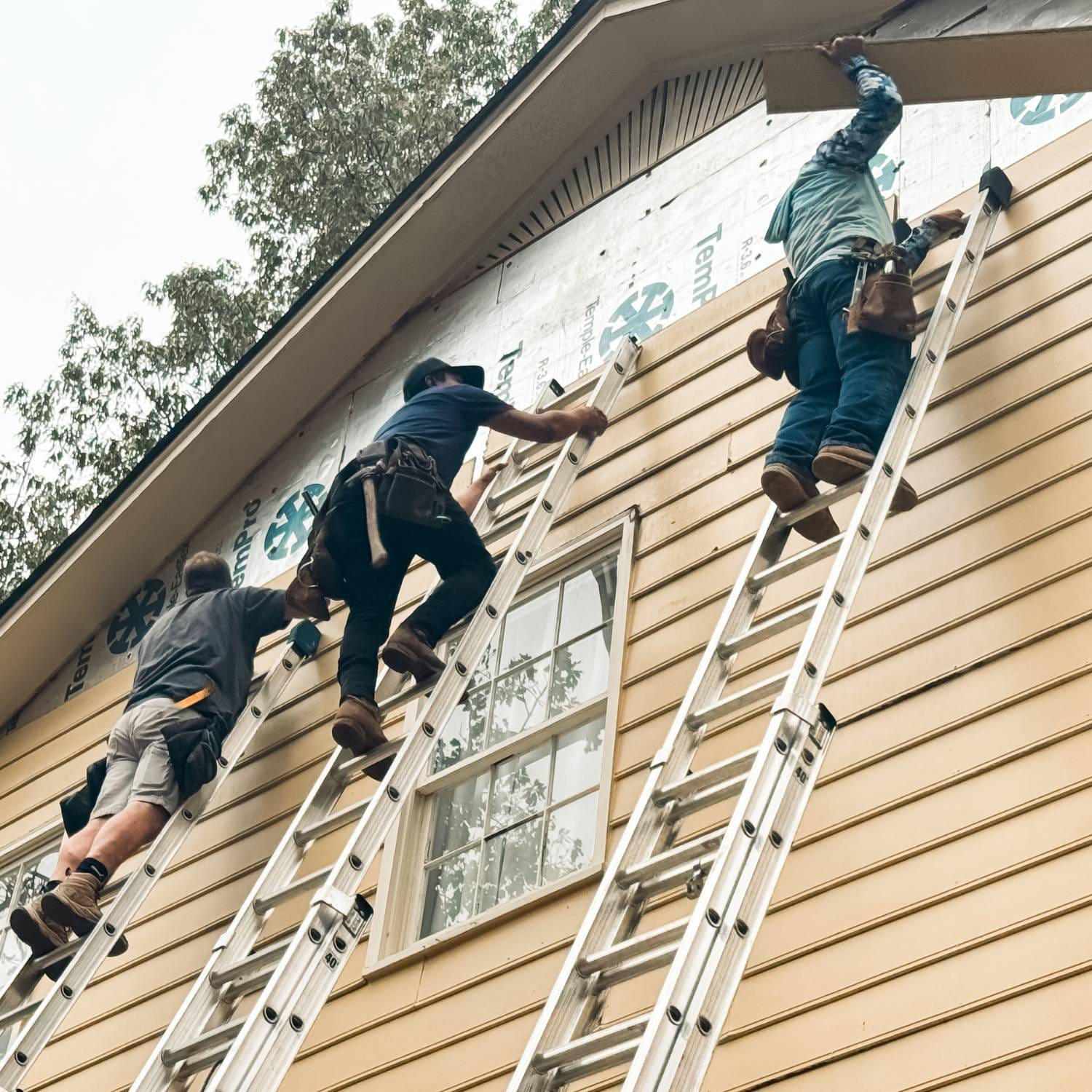 A siding replacement in Vestavia Hills, AL, with a crew installing durable Hardie siding for improved curb appeal and protection.