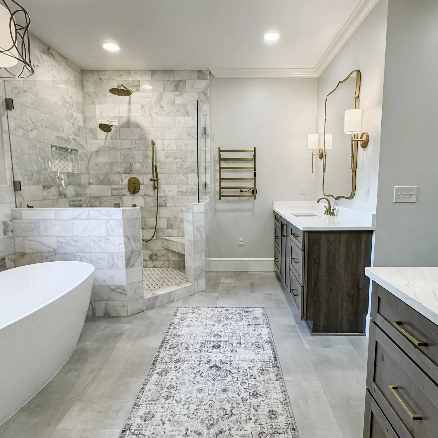 A stunning example of Hoover bathroom remodeling with a luxurious walk-in shower, freestanding tub, and custom vanities designed for both style and functionality.