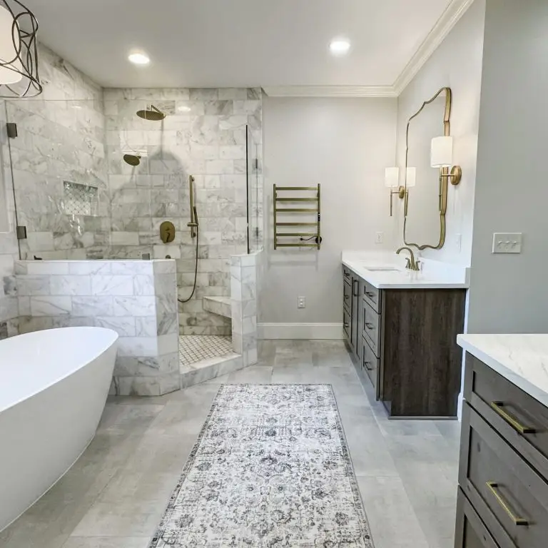 A stunning example showing the bathroom remodel cost in Hoover, AL with a luxurious walk-in shower, freestanding tub, and custom vanities designed for both style and functionality.