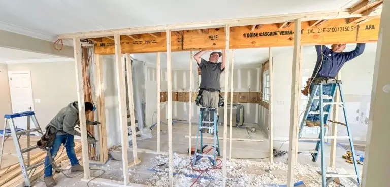 Contractors are framing a new interior wall in a home under renovation.