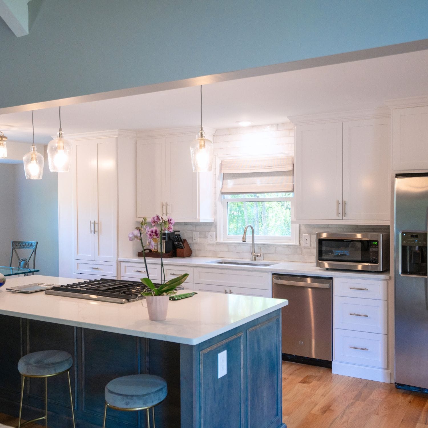 This kitchen renovation on Kent Dairy Road features a spacious layout, stainless steel appliances, and a large island perfect for cooking and entertaining.