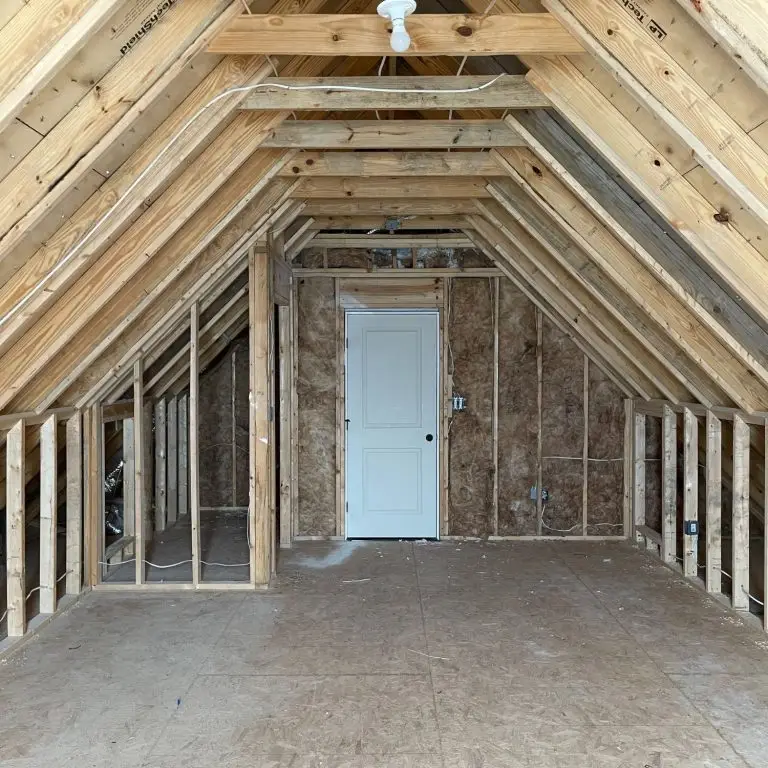 Framed attic space mid-construction with new wiring and insulation, showing typical progress at week 4 of a remodel — part of our guide on How Long Does It Take to Finish an Attic.