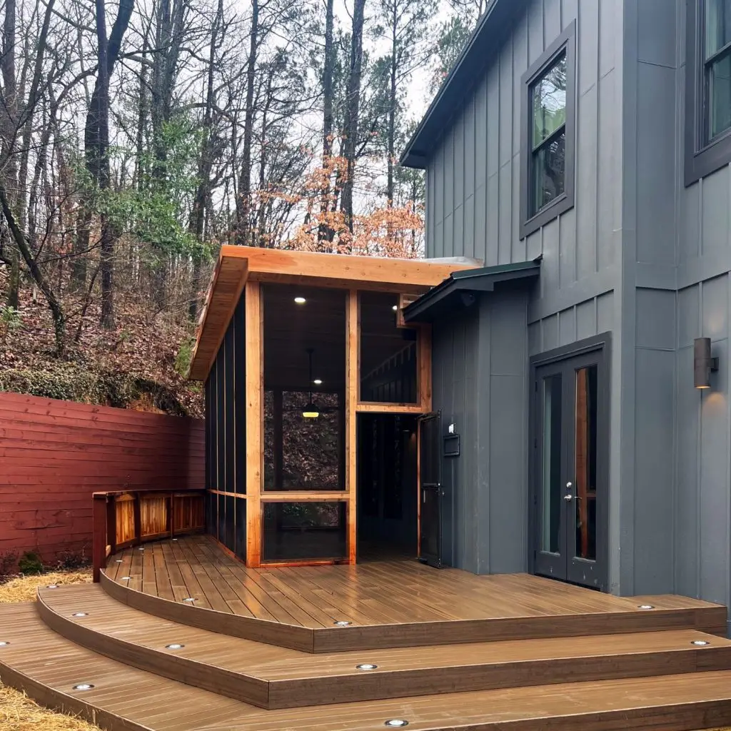 Modern screened-in porch with cedar trim, recessed lighting, and composite decking—example of HOA Approval to Build a Covered Porch in Pelham.