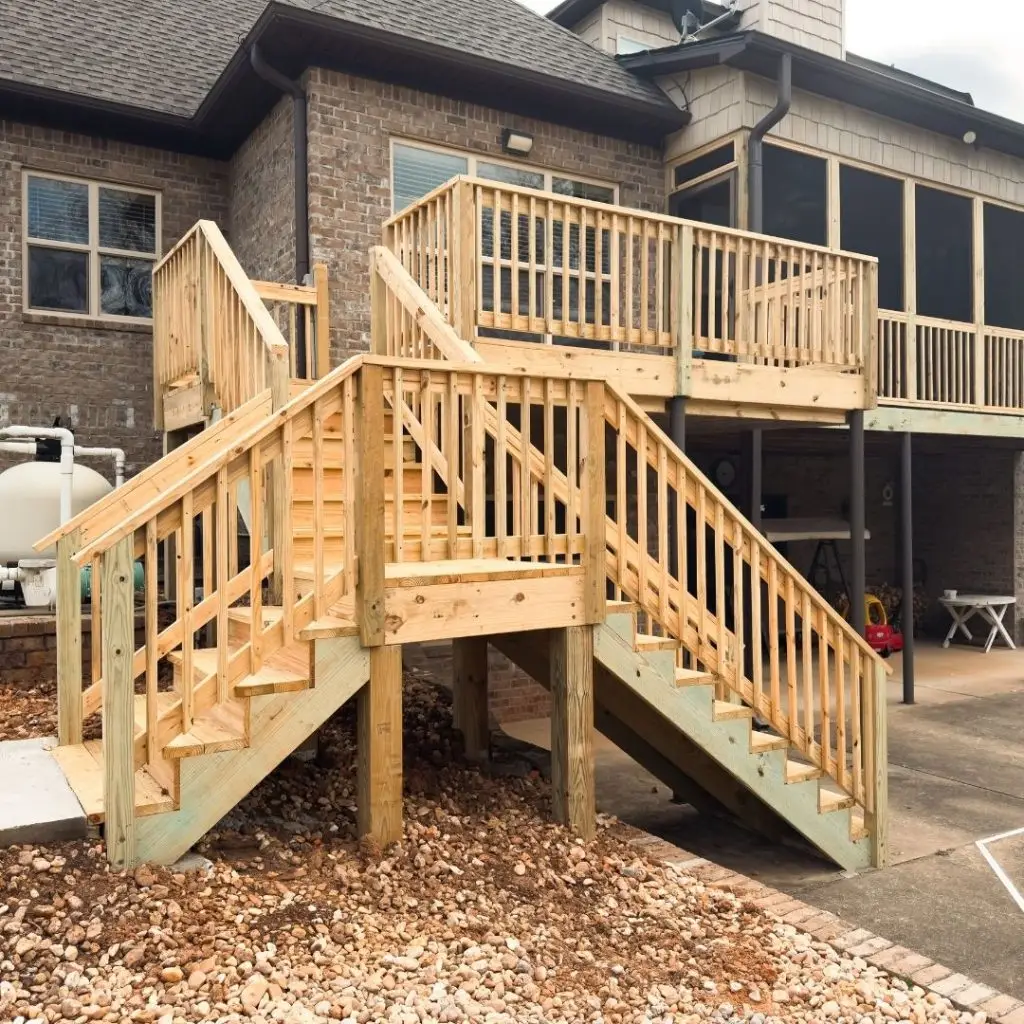Multi-level wooden deck with staircase, built by a trusted deck contractor in Mountain Brook.